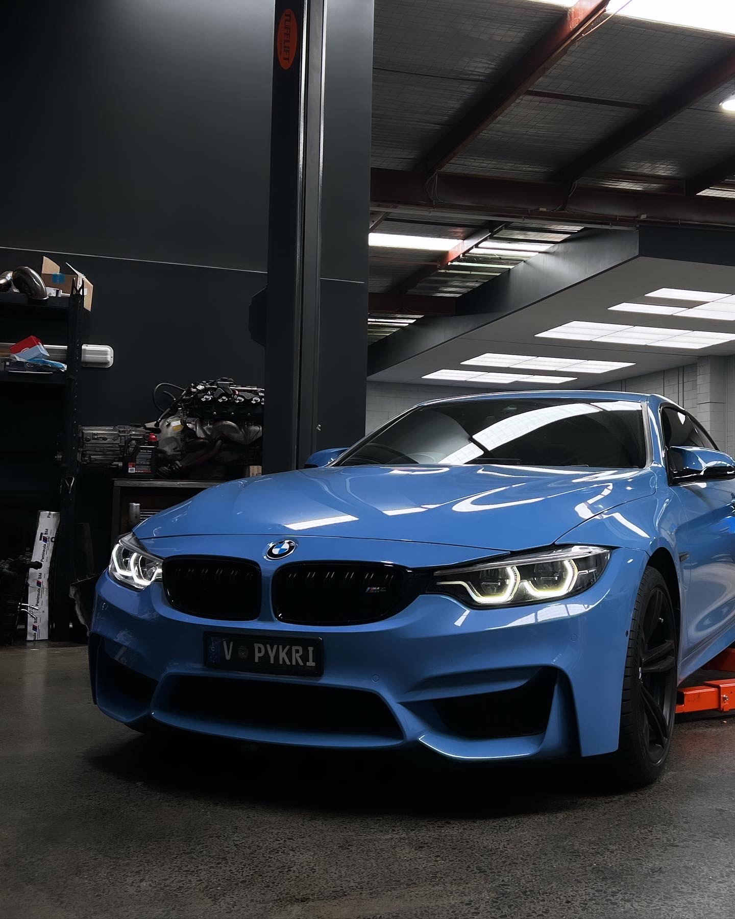 BMW M4 on the hoist during a tune at Apex Melbourne