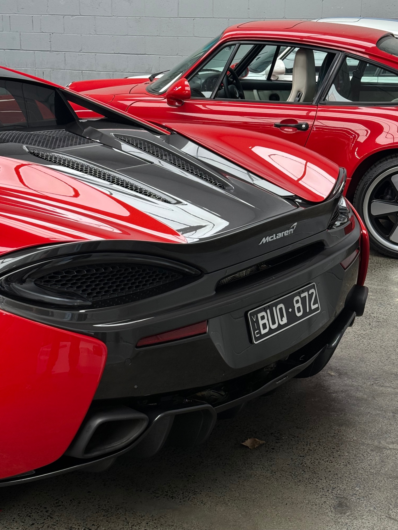 Porsche and McLaren in the Apex Wantirna South workshop