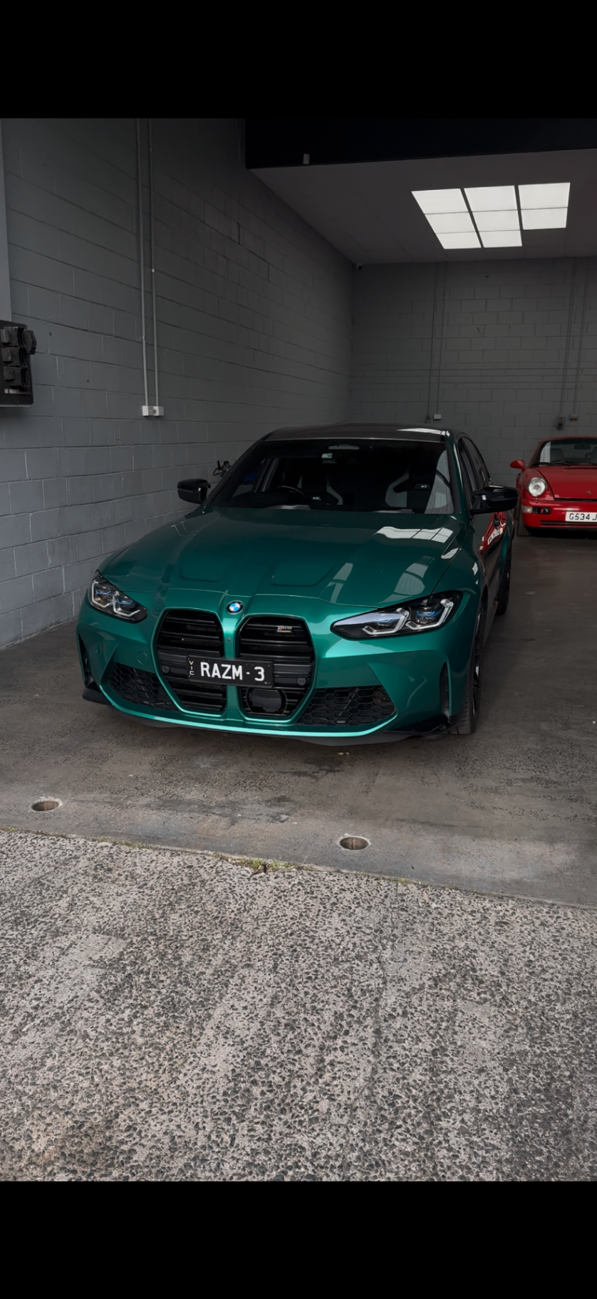 Green BMW G80 M3 in the Apex Melbourne workshop