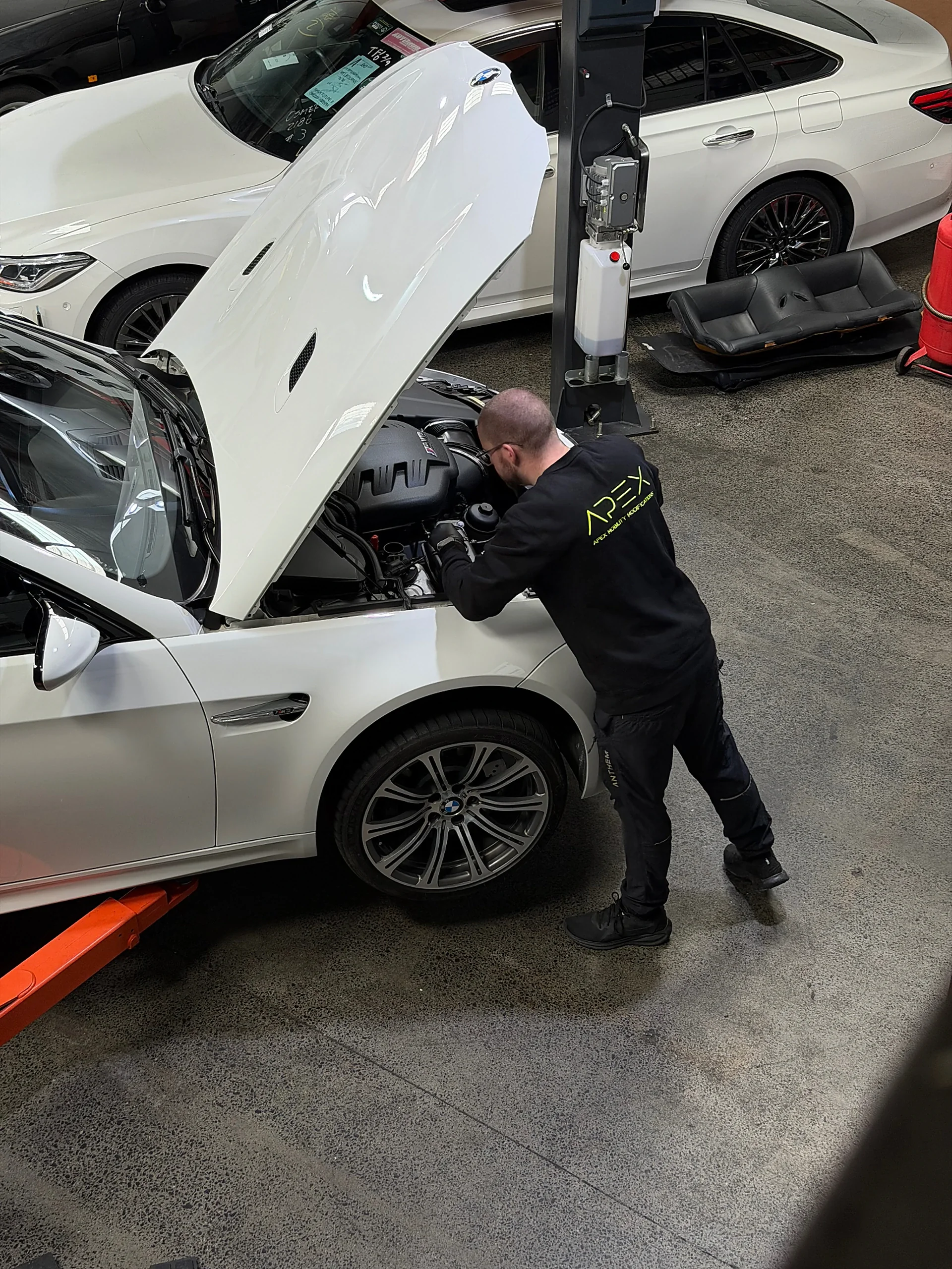 Apex Performance Tuning technician carrying out a service on a BMW E92 M3