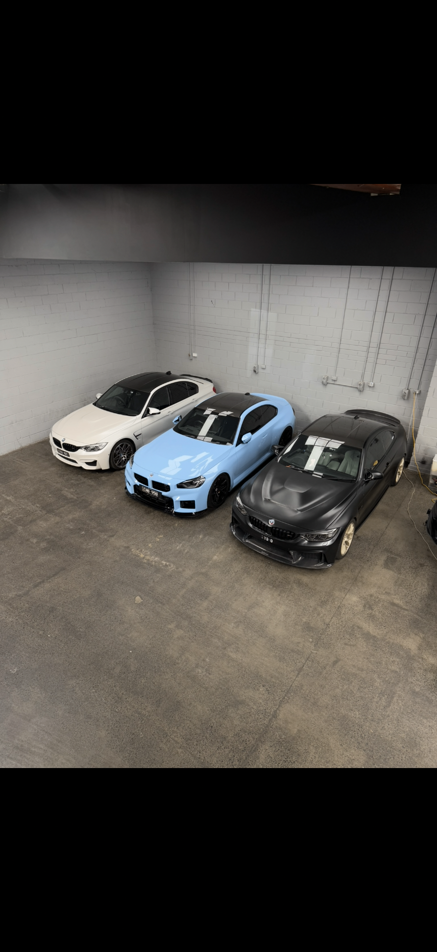 BMW M car line-up inside the Apex Performance Tuning workshop