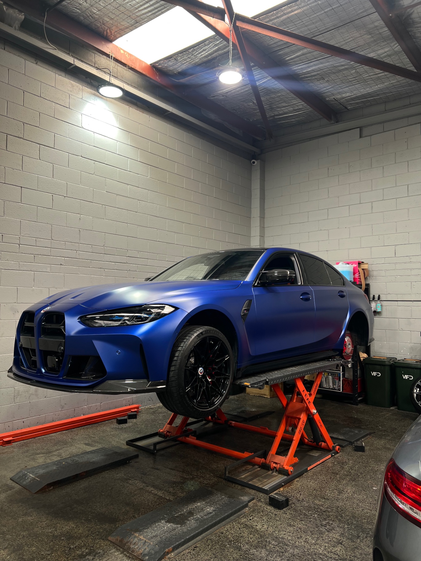 BMW M3 on the hoist for log book servicing at Apex Melbourne